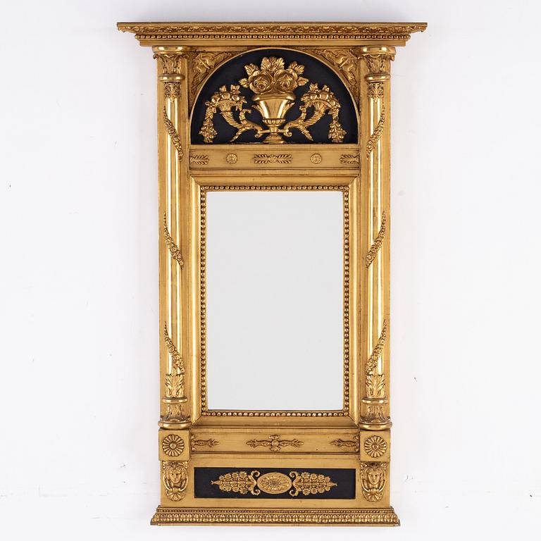 An empire mirror by JF Sellberg dated 1823.