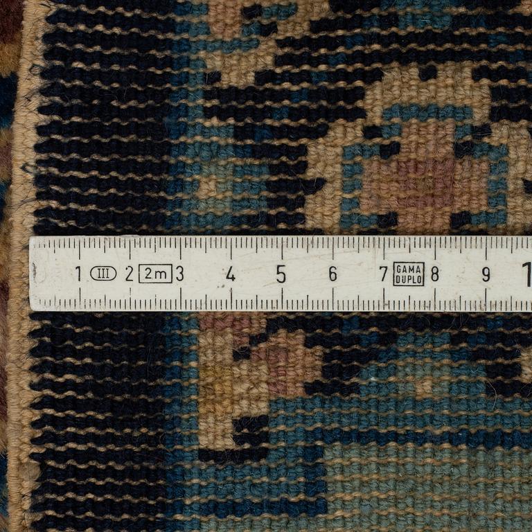 A RUNNER, an old China, ca 298 x 77,5 (as well as 1 cm flat weave at both ends), "antique finish".