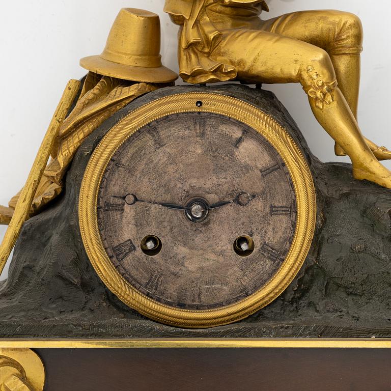 An ormolu and patinated bronze mantel clock, mid 19th Century.