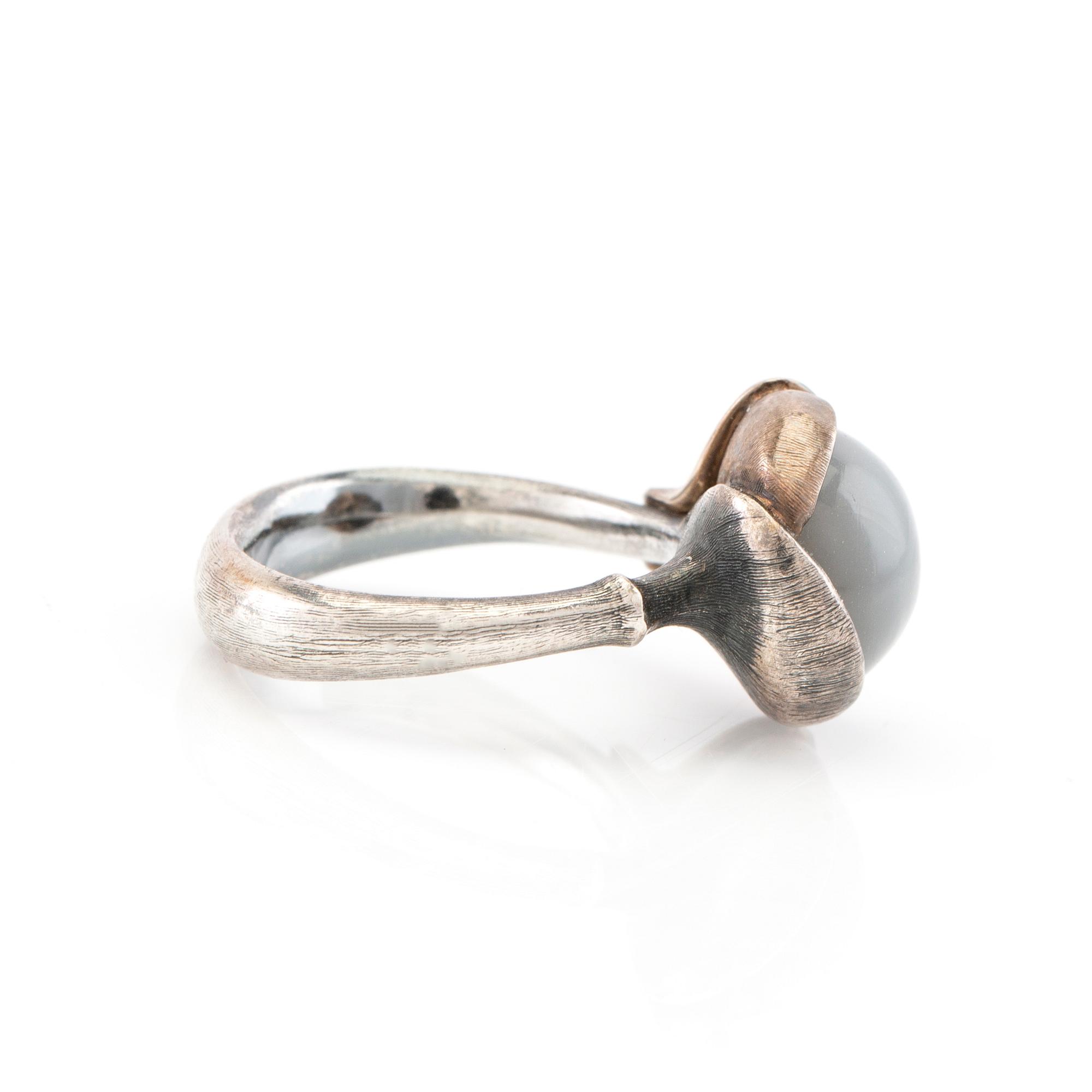 Ole Lynggaard, ring "Lotus" silver, white gold and cabochon-cut moonstone, design Charlotte Lynggaard.