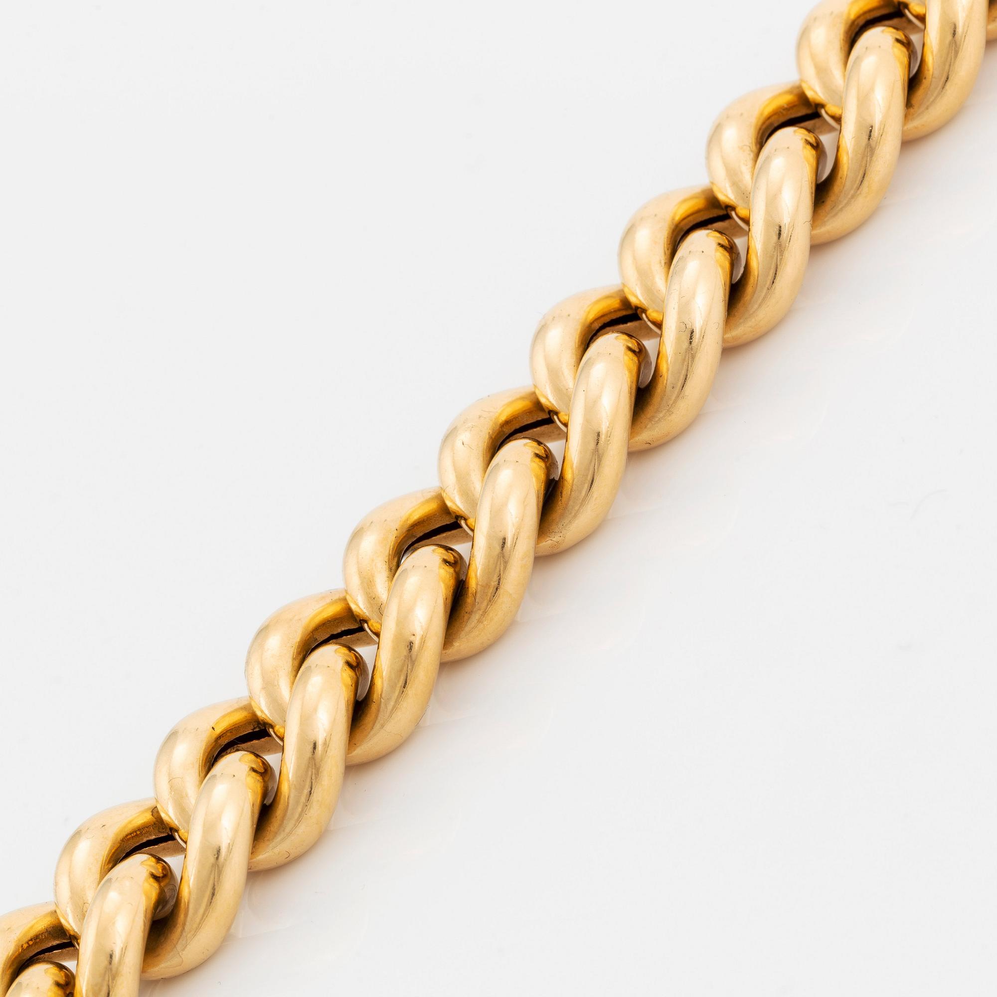 An 18K gold bracelet.