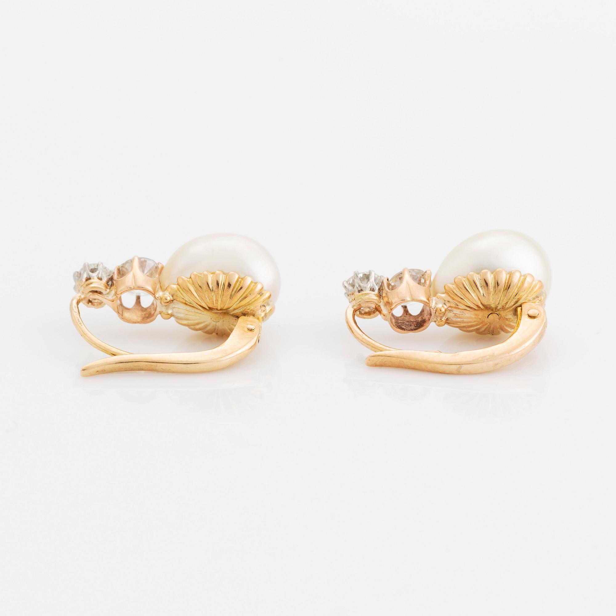 A pair of 18K gold and pearl earrings set with old-cut diamonds.
