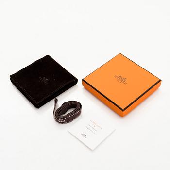 Hermès, a 'Clic H' bracelet.
