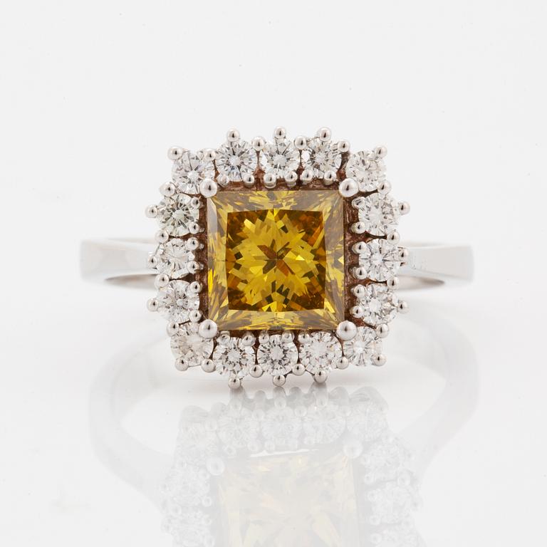 Princess-cut colour treated fancy deep brown-yellow diamond ring.