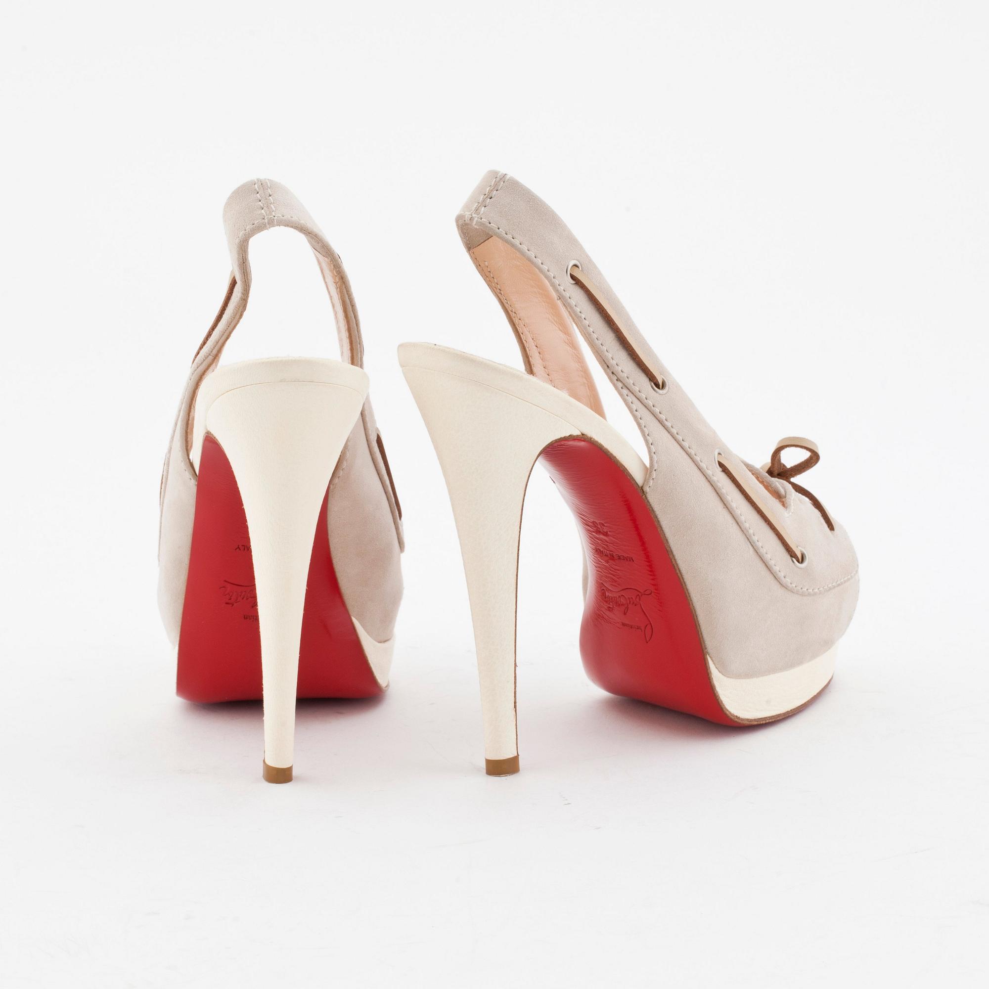 CHRISTIAN LOUBOUTAIN, a pair of grey suede and withe leather slingbacks.