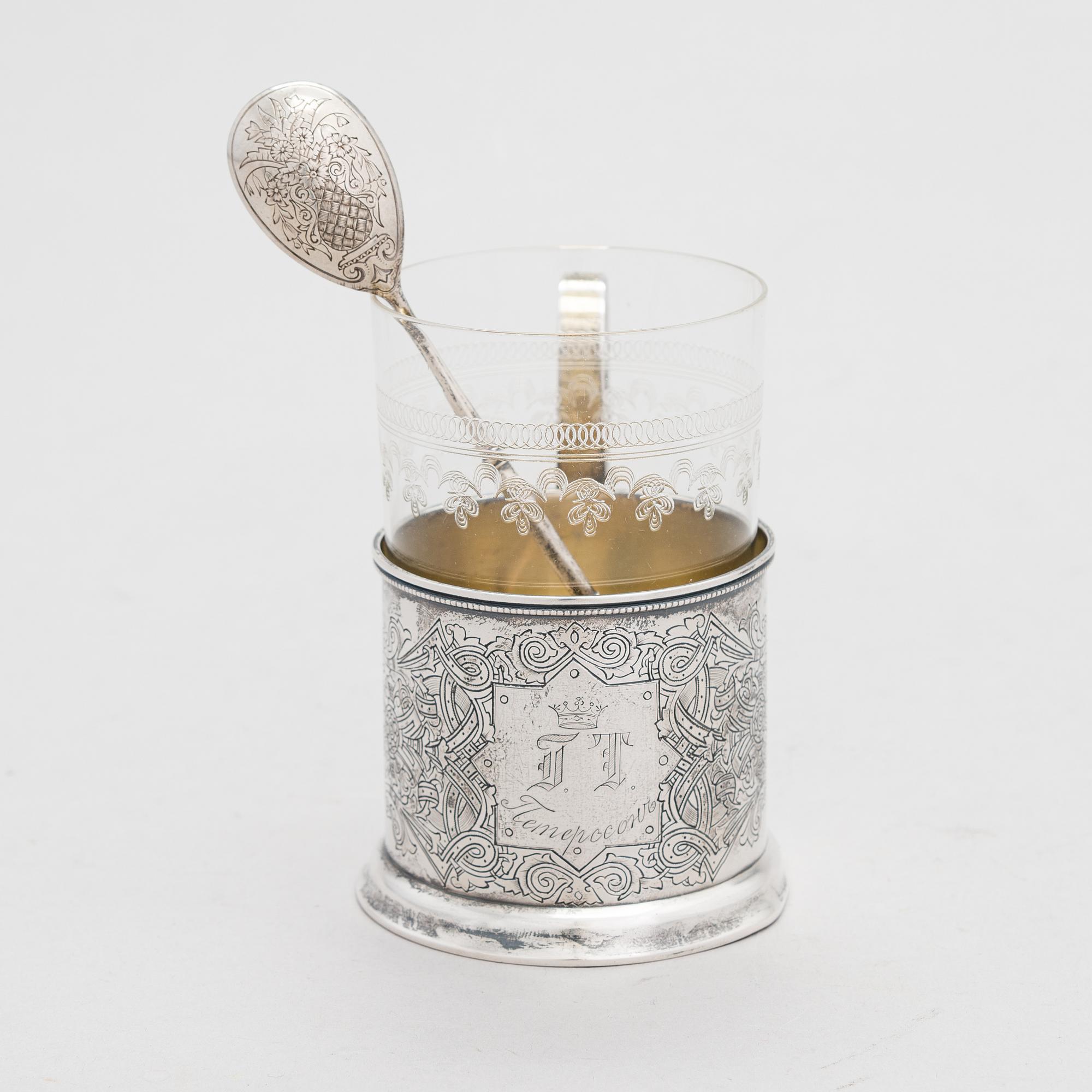 A Russian silver tea glass holder and a tea spoon, Moscow, Alexander Fuld 1889 and Antip Kuzmichev 1888. Glass, Finland.