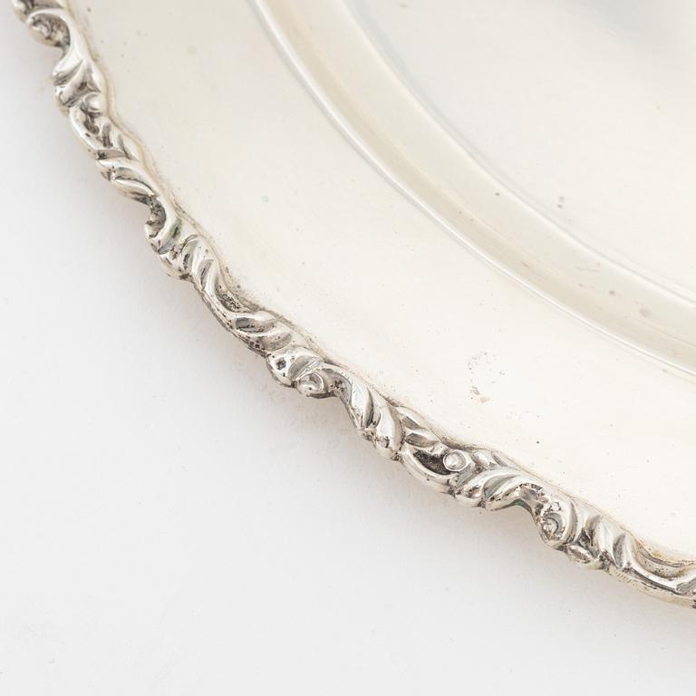 Juventino Lopez Reyes, a set of 12 Rococo style sterling silver dishes, Mexico, 20th Century.