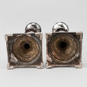 A pair of silver Sabbath candlesticks, Maker M. Sztern, Warsaw, Poland. Assayer Josef Sosnkowski, 1864. Weight 833 g.