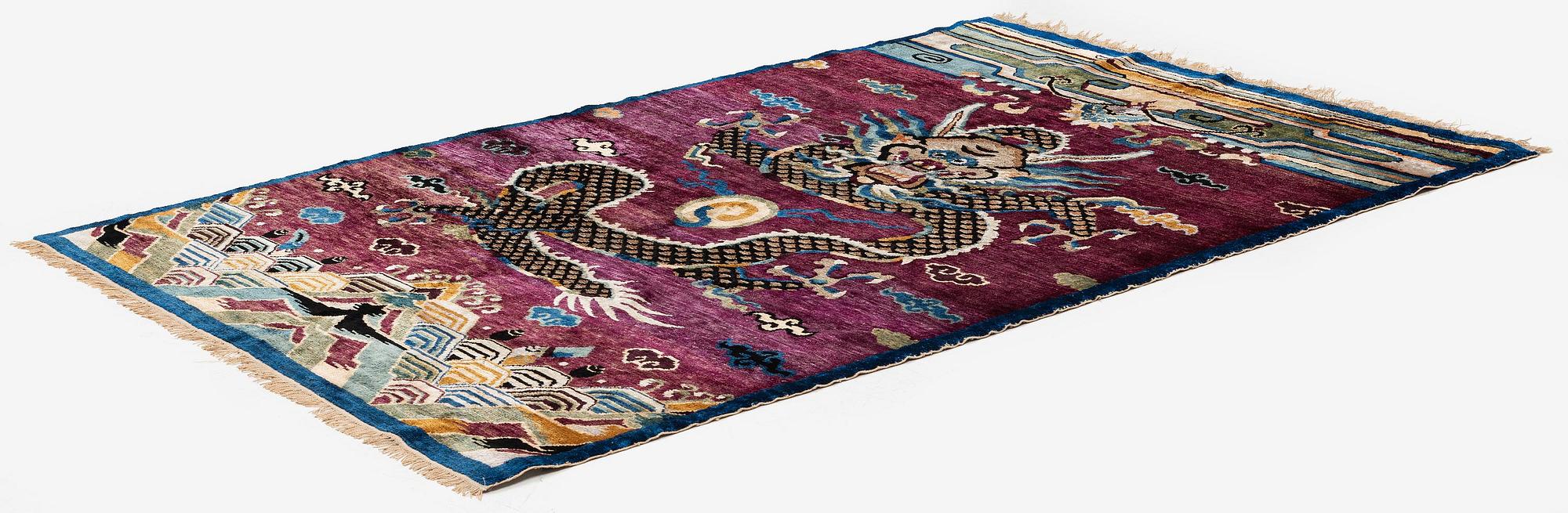 A Chinese silk and metal-thread 'Dragon' pillar rug, Bejing, North China, around 1910, c. 234x151 cm.