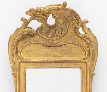 A giltwood rococo mirror, Stockholm, later part 18th century.