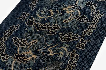 A Chinese 'dragon' rug, circa 1920. (c 190x122 cm).