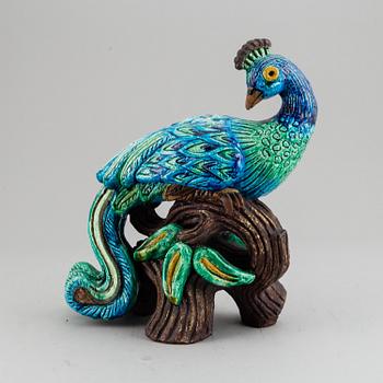 GUNNAR NYLUND, a stoneware figurine of a peacock, Rörstrand.