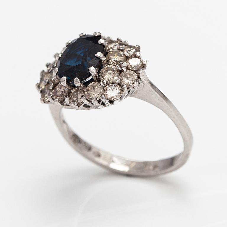 A 14K white gold ring with a sapphire ca. 1.24 ct and diamonds ca 1.25 ct in total. Finnsh import marks 1994.