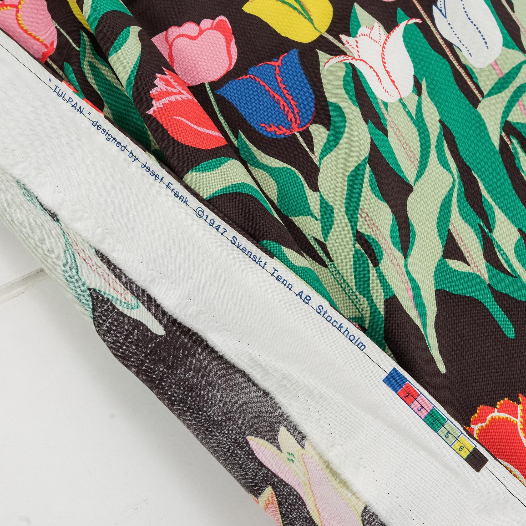 A cotton curtain and 6 pillows, in the textile "Tulpan", Firma Svenskt Tenn.