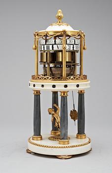 A Louis XVI late 18th century gilt bronze and marble mantel "cercles tournants" clock .