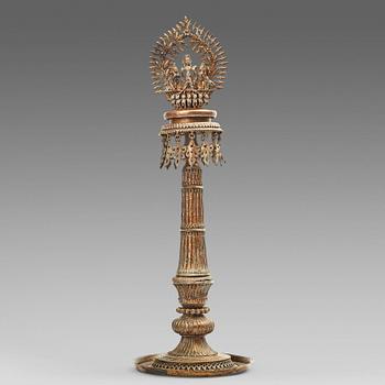 734. A copper alloy temple lamp, Nepal, circa 1900.