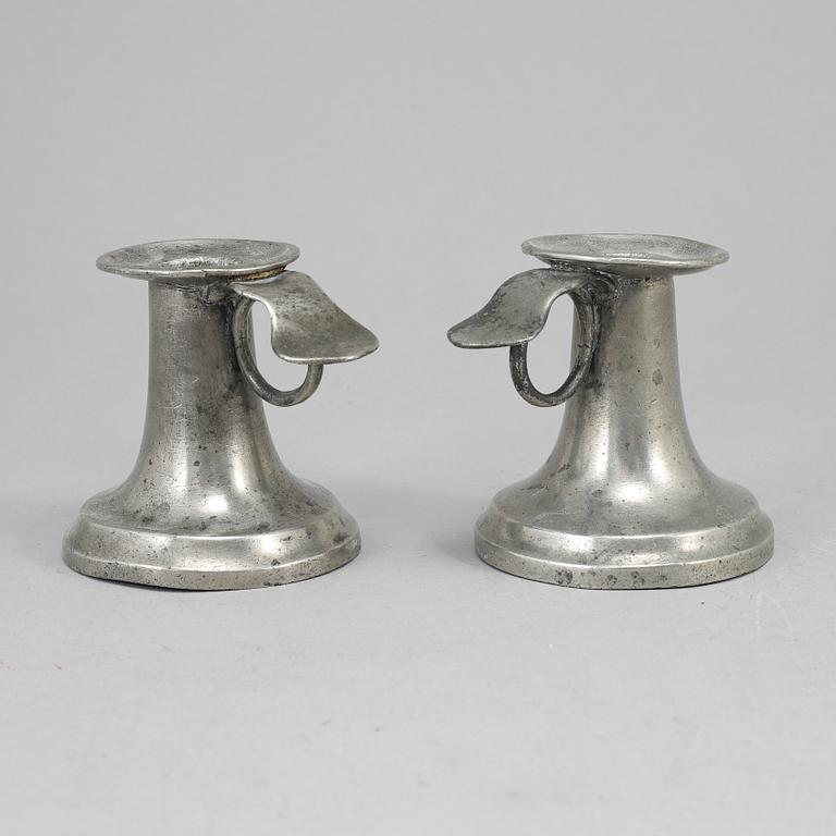 A pair of 19th century pewter candlesticks.