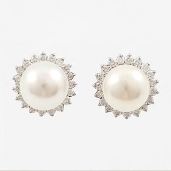 Earrings, a pair, 18K white gold with cultured pearls and brilliant-cut diamonds.