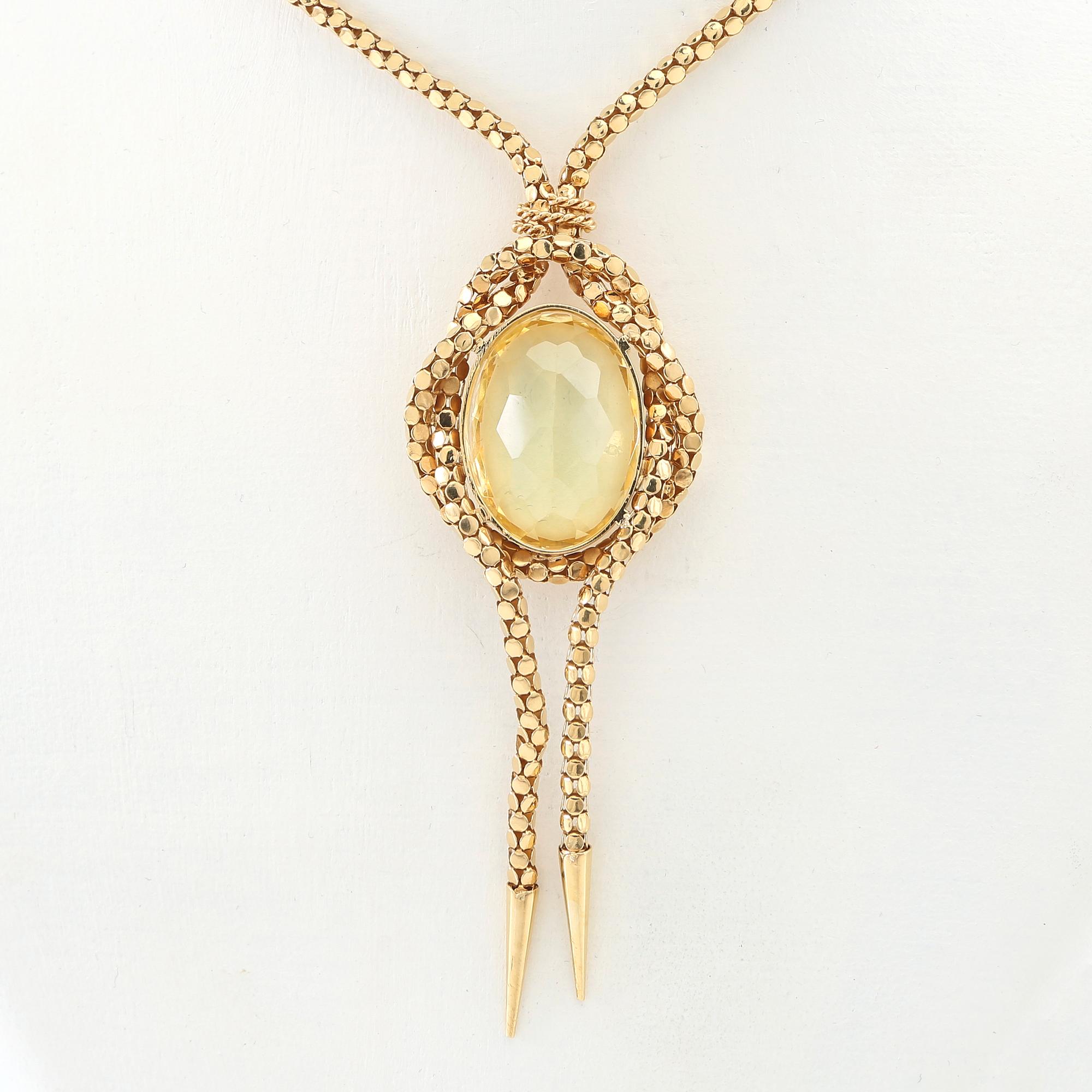 Necklace 18K gold with an oval faceted green synthetic spinel.