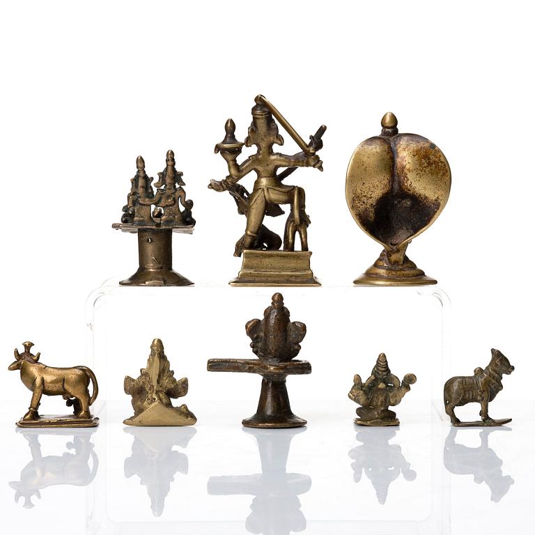 A group of eight brass miniatures, India, 19th/20th Century.