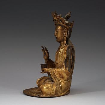 A gilt-bronze figure of a seated Guanyin, Ming dynasty (1368-1644).