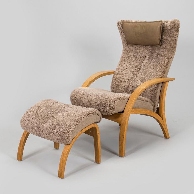 A 'Delta Adventure' armchair with ottoman, Brunstad, Norway.