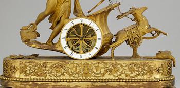 A French Empire gilt bronze mantel clock.