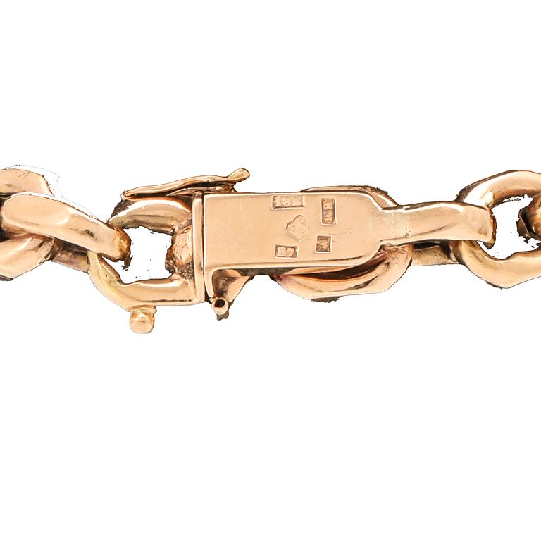 An 18K gold anchor link bracelet.
