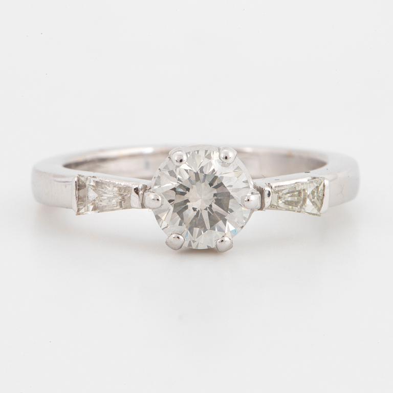 A 14K gold ring set with a round brilliant-cut diamond.