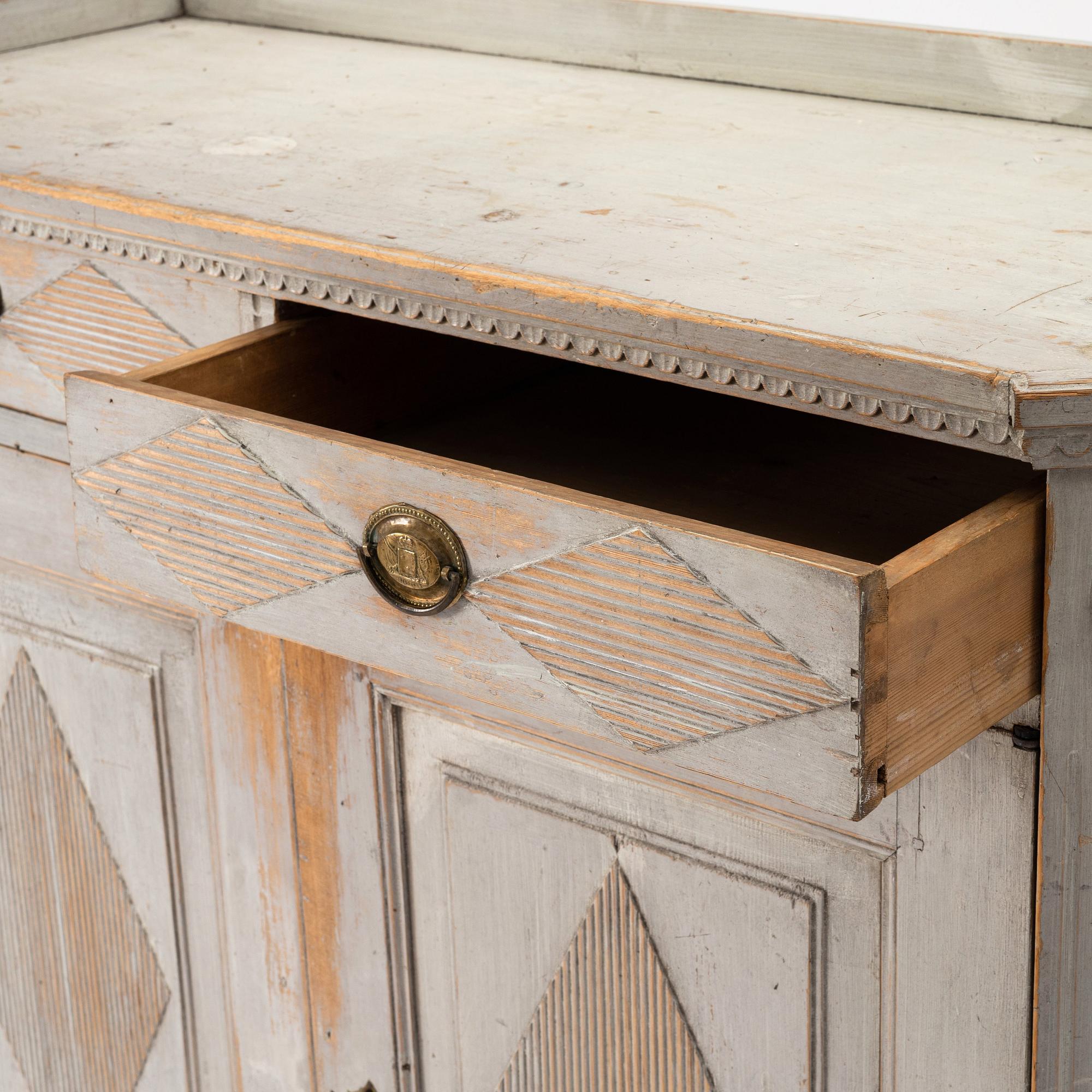 A late Gustavian grey lacquered pine cabinet, Sweden ca 1800.