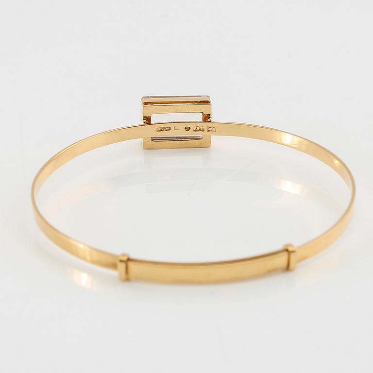 Armband 18K guld med en trappslipad syntetisk vit spinell, G. Dahlgren & Co Malmö 1969.