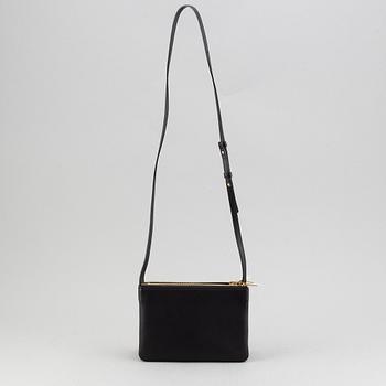 Céline, a black leather 'Trio Bag'.