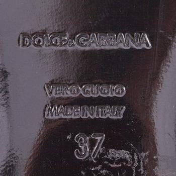 DOLCE & GABBANA, a pair of black leather sandals.