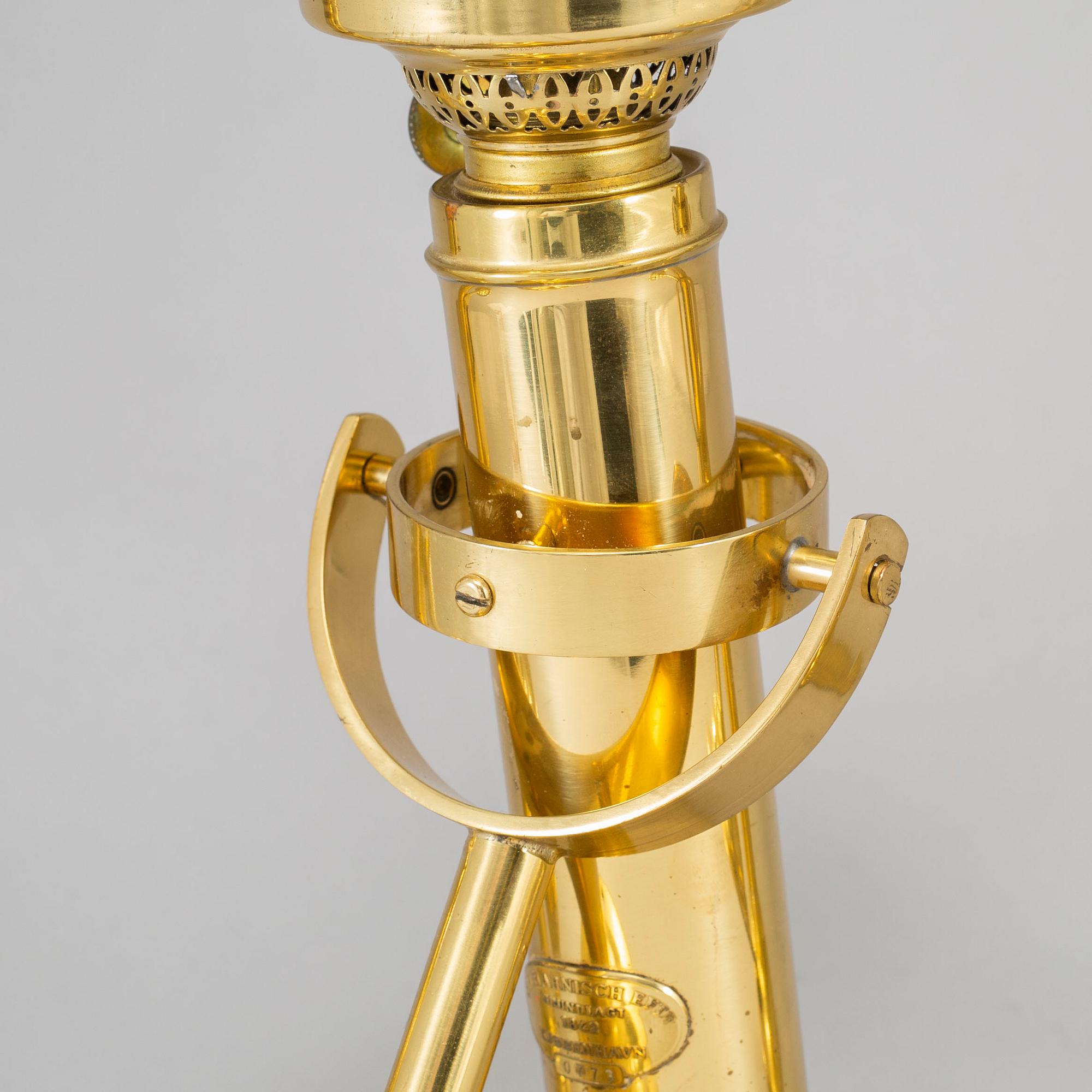 A set of three brass kerosene lamps GV Harnisch Denmark later part of the 20th century.