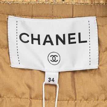 Chanel, a gold bouclé jacket, size 34.