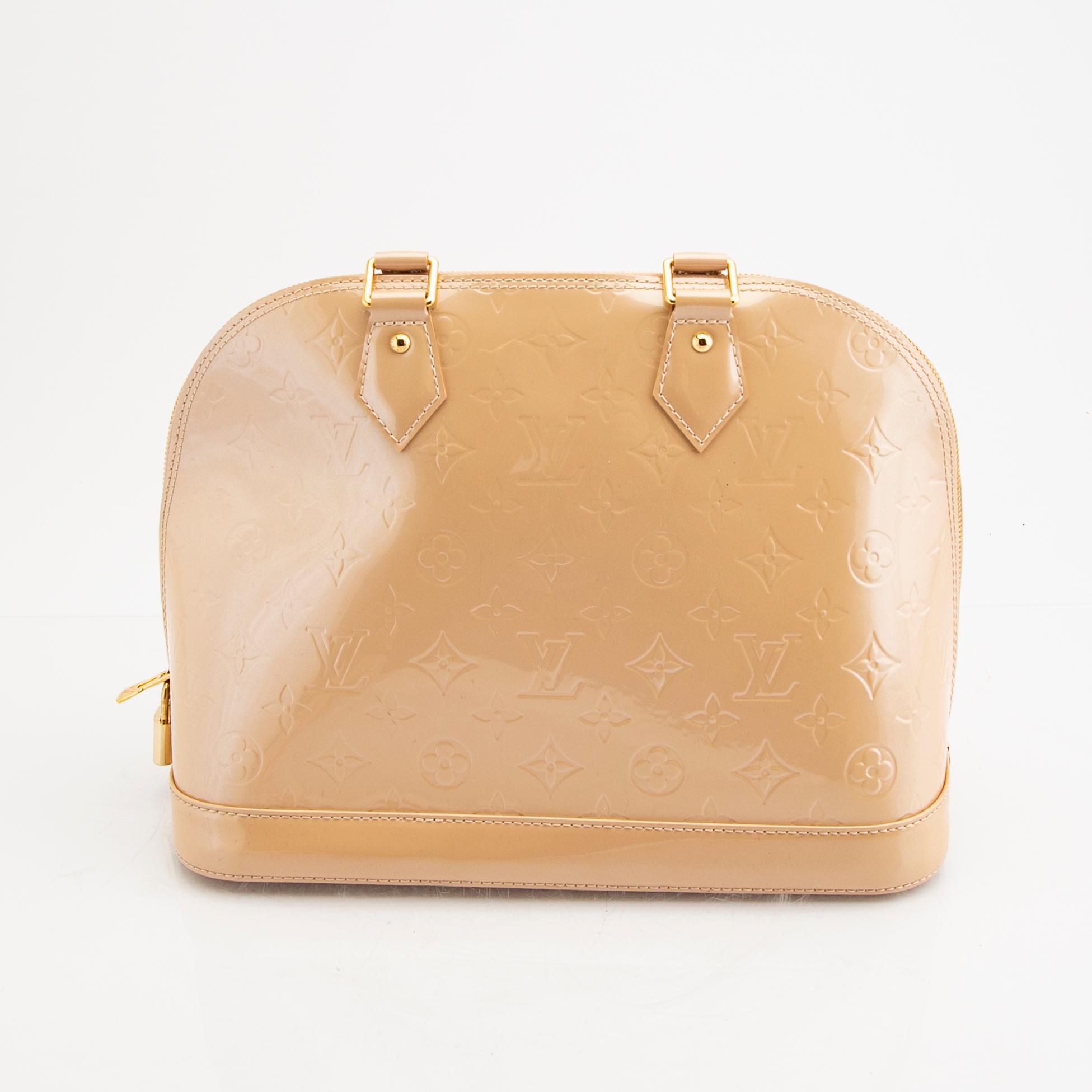 Louis Vuitton, an "Alma PM" handbag.