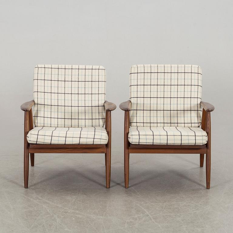 A pair of second half of the 20th century armchairs.