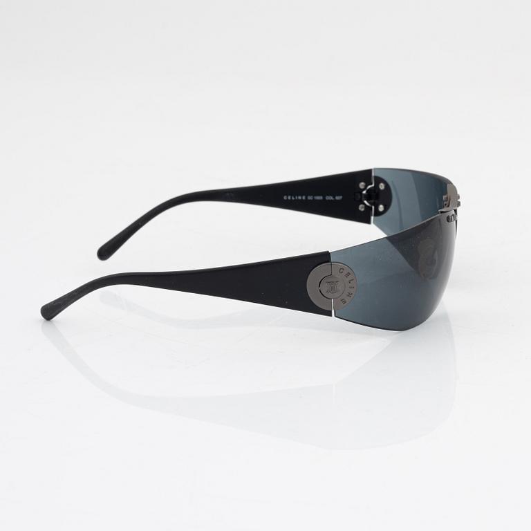 Céline, a pair of black and silver-color sunglasses.