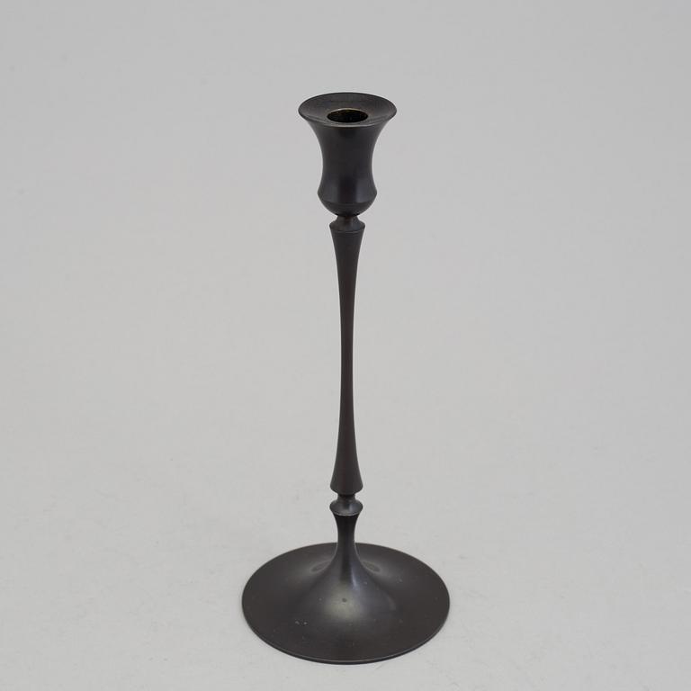 A bronze "Egg and dart candlestick" by E.R. Butler, Ted Muehling.