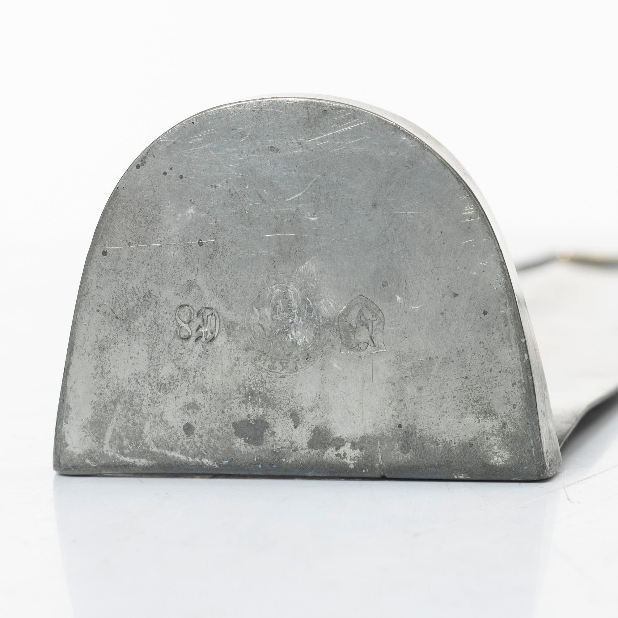 Nils Fougstedt, a matched pair of pewter and brass wall sconces, model A 60, Svenskt Tenn, Stockholm 1929 and 1932.