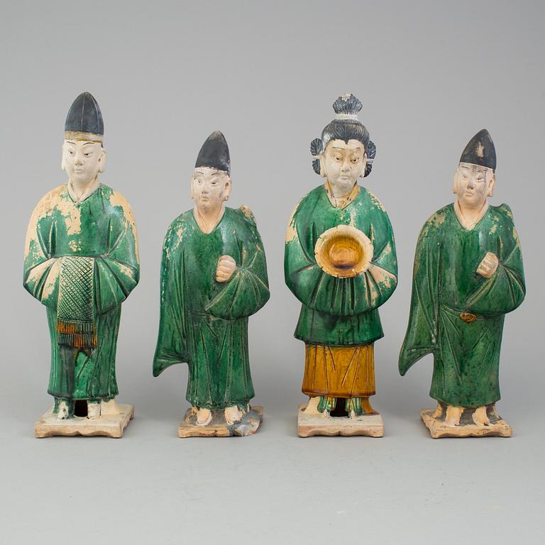 A group of eight chinese figures with three objects, earthenware, Ming dynasty.