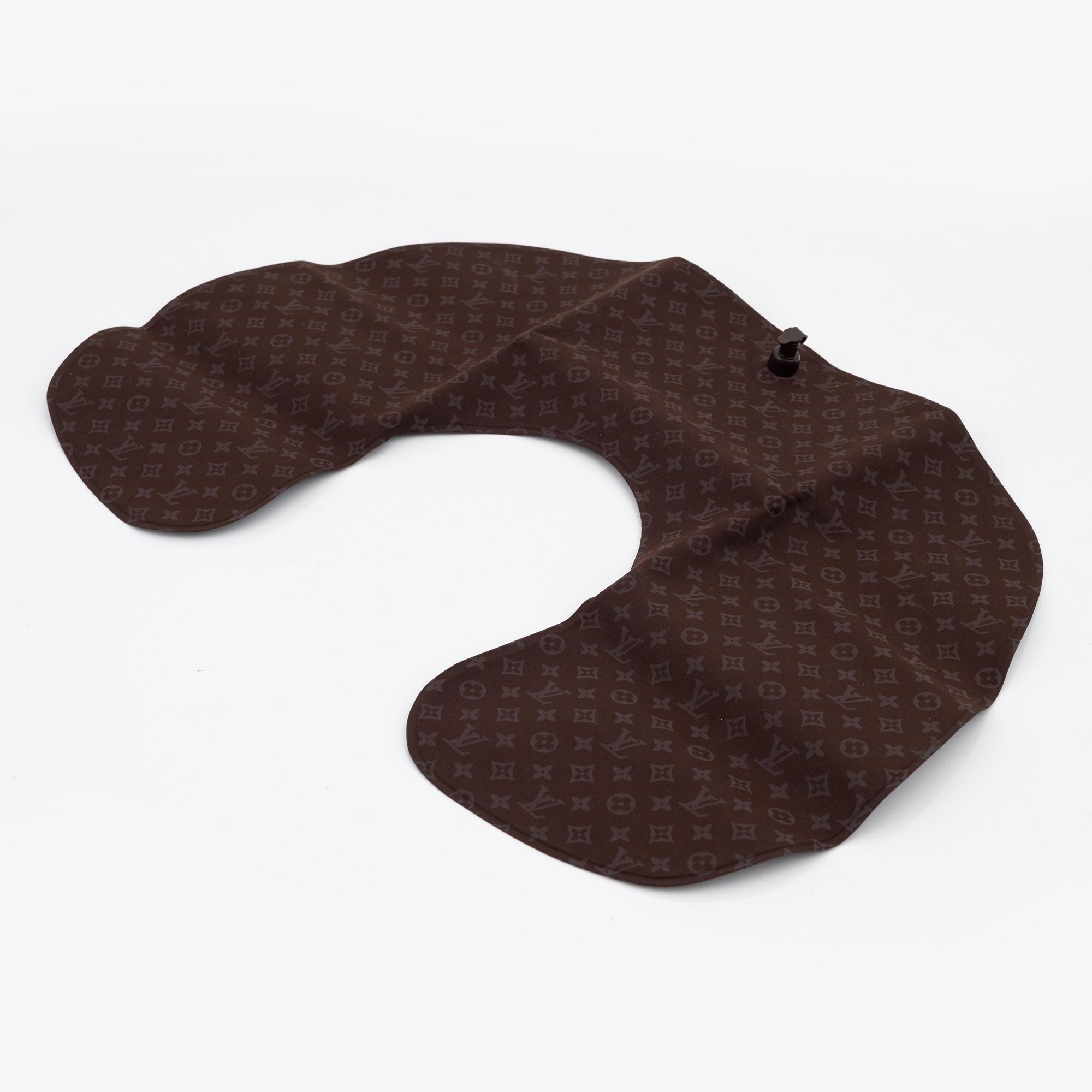 Louis Vuitton, a monogram "Trousse kit de voyage' travel kit with inflatible pillow and eye mask.
