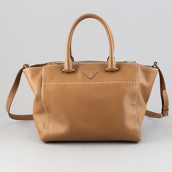 Prada, a leather handbag.