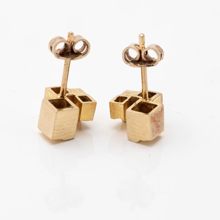 A pair of 18K gold earrings.