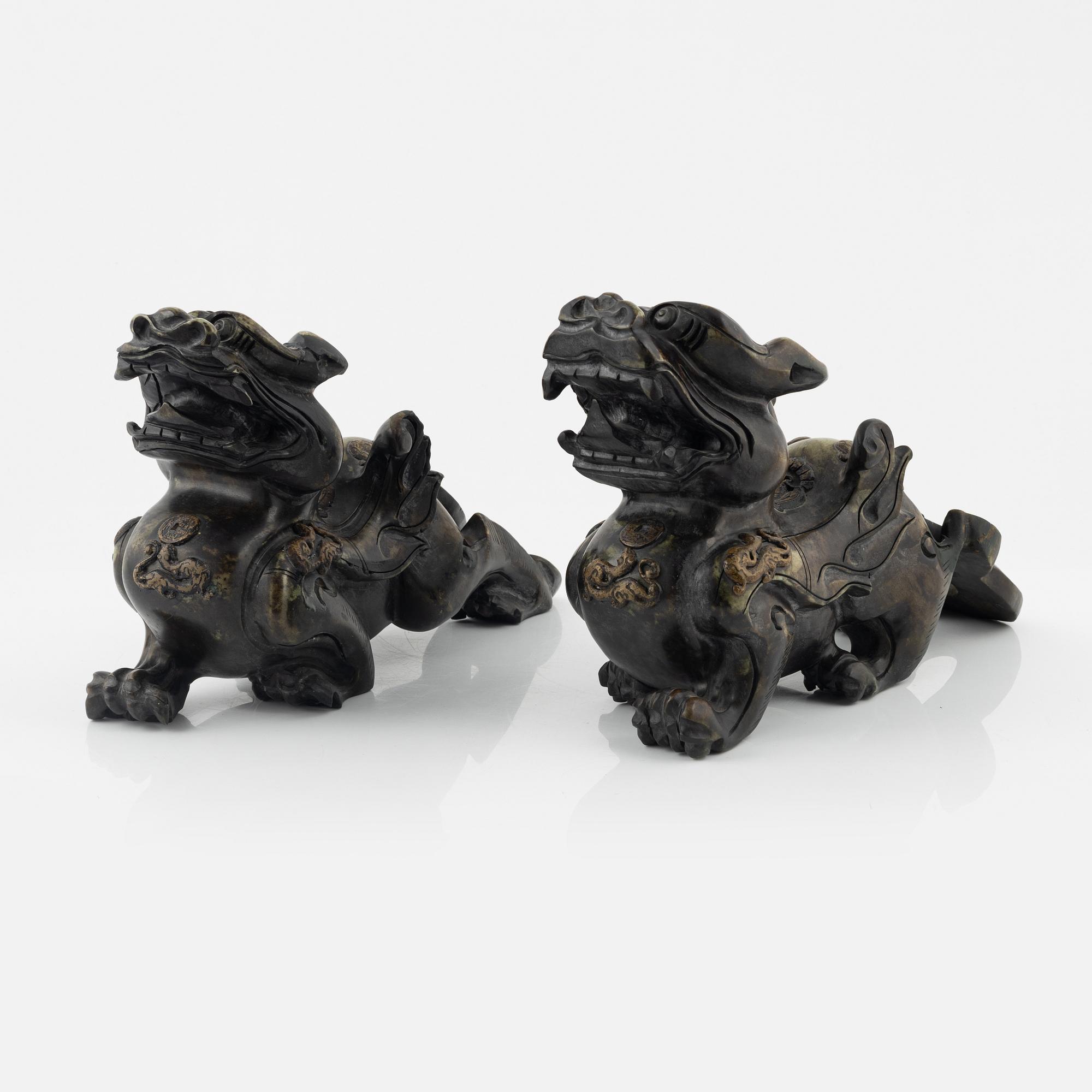 A pair of Chinese stone sculptures of mythical creatures, 20th Century.