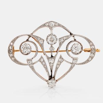 1102. A platinum and 18K gold brooch set with old-cut diamonds.