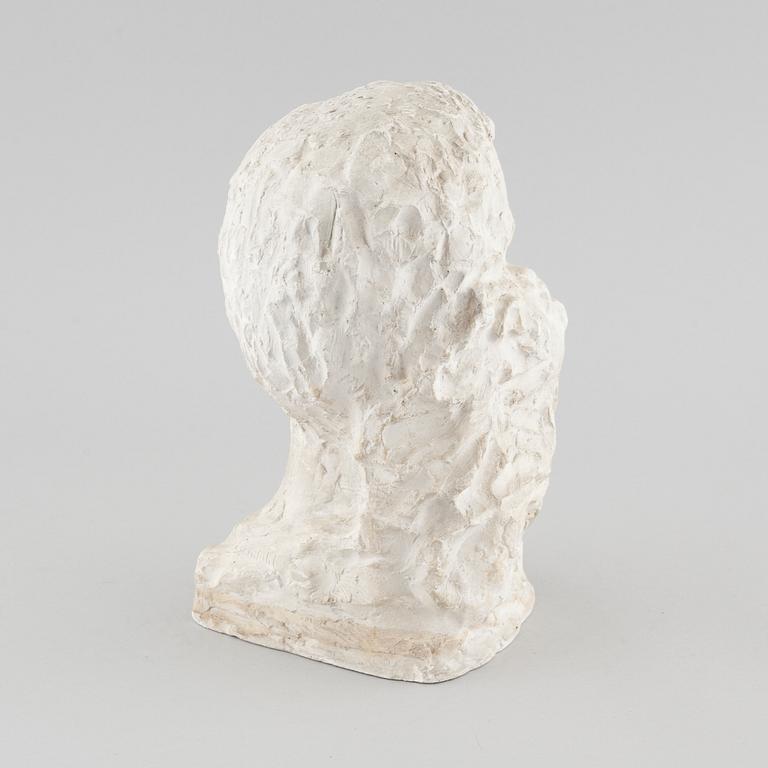 a plaster sculpture, signed.