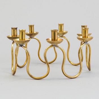 A Lars Holmström brass candle holder for seven candles, Svenskt Tenn, second half of the 20th century.
