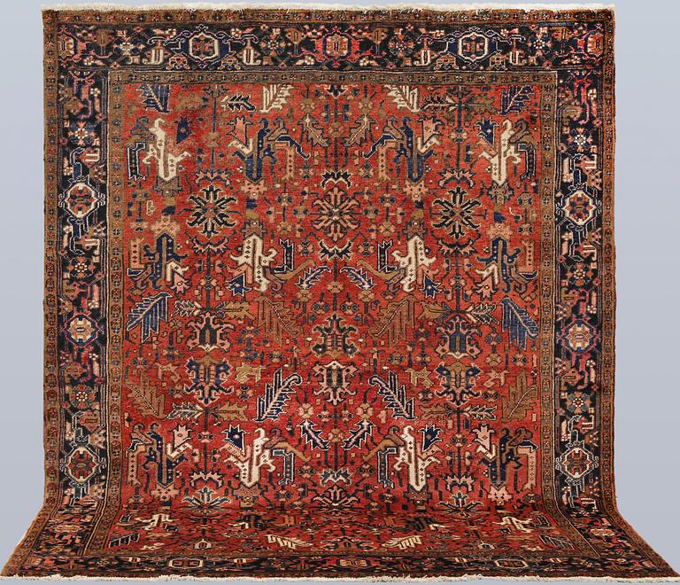 A semi-antique Heris rug, c. 287 x 230 cm.