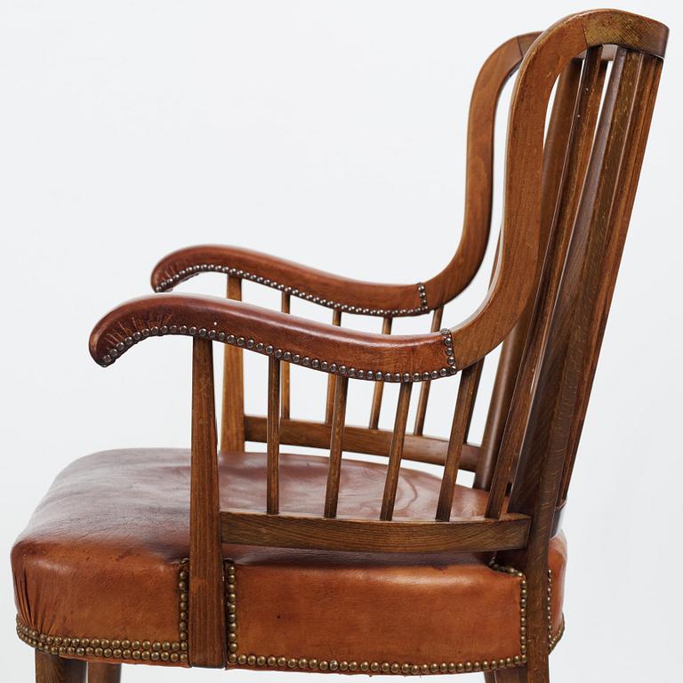 Otto Schulz, a Swedish Modern stained beech and cognac coloured leather armchair.